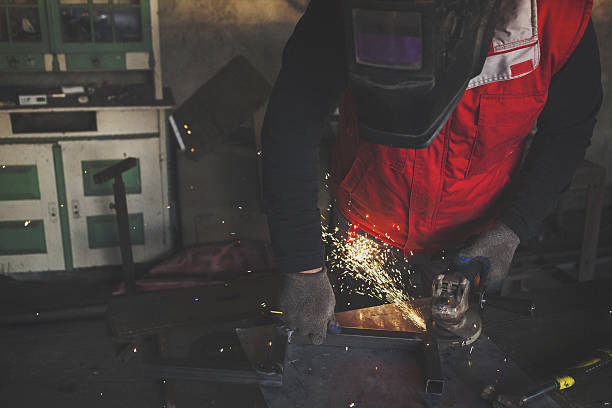 istock Man grinding metal shot from above 639125232