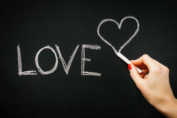 istock woman writes a word love 639125488