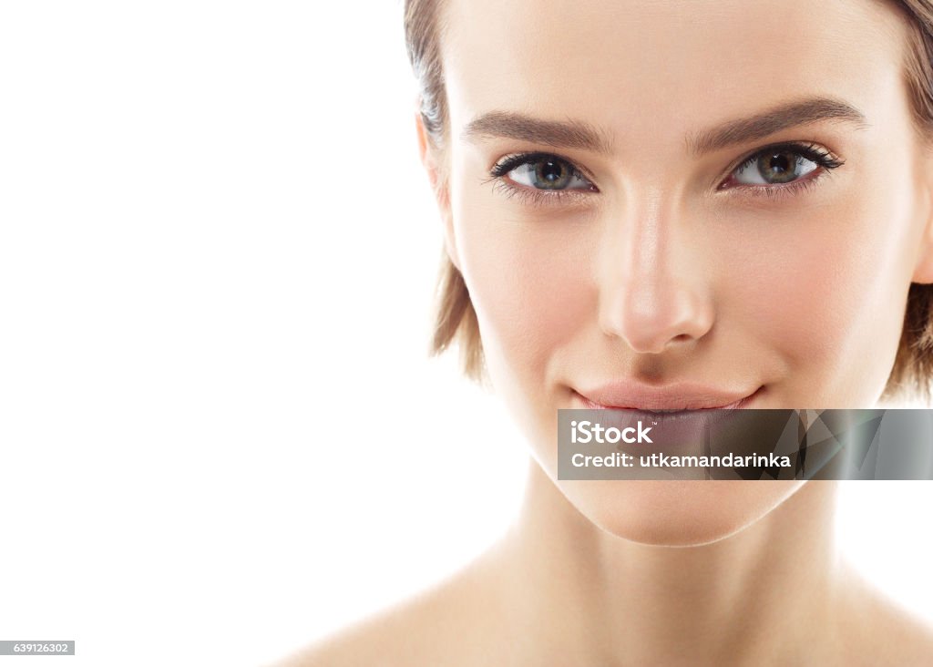 Beauty Woman face with perfect skin Portrait. Isolated on white. Beauty Woman face Portrait. Beautiful model Girl with Perfect Fresh Clean Skin color lips purple red. Blonde brunette short hair Youth and Skin Care Concept. Isolated on a white background Beauty In Nature Stock Photo