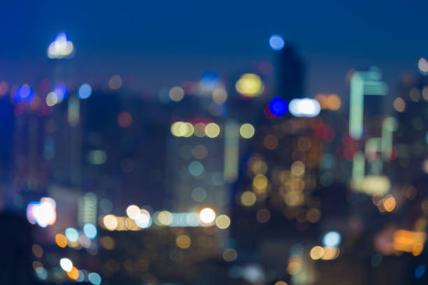 istock Nights blurred bokeh lights office building 639127550