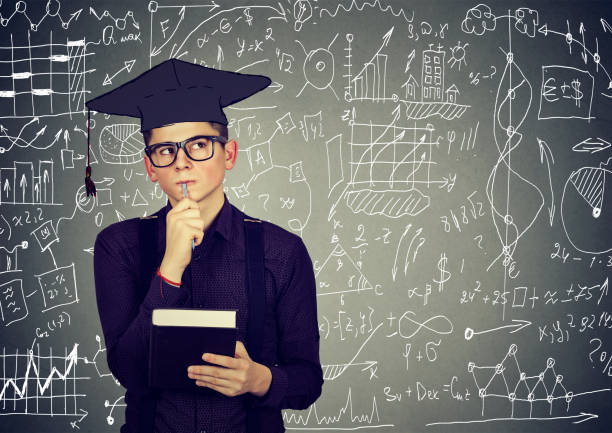 istock Man in graduation cap with book thinking about education 639128998