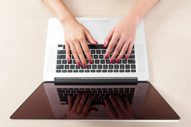 istock Woman hand typing on laptop keyboard 639130602