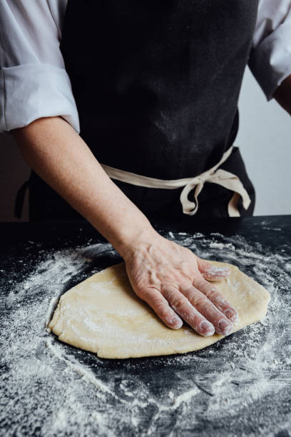 istock Person rolling homemade cookie dough 639132362