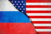 united states of america flag on wall and russian flag