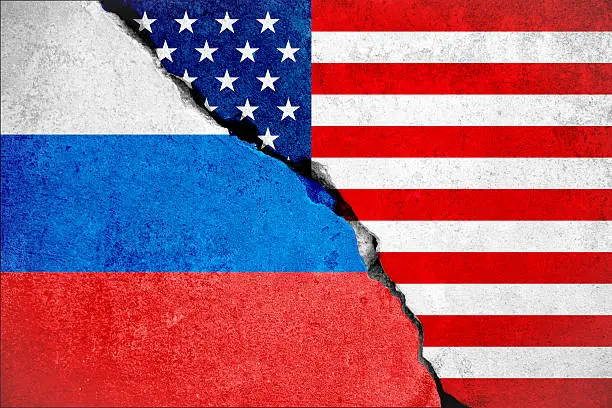 united states of america flag on broken damage wall and half russian white red blue color flag, relationship crisis between russia and usa concept