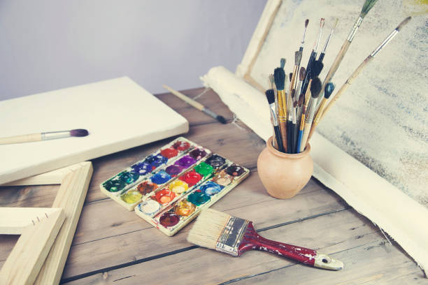 istock brushes, canvas, watercolor on the table 639135634