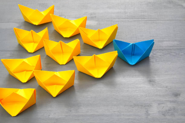 istock Leadership concept with paper boats 639135724
