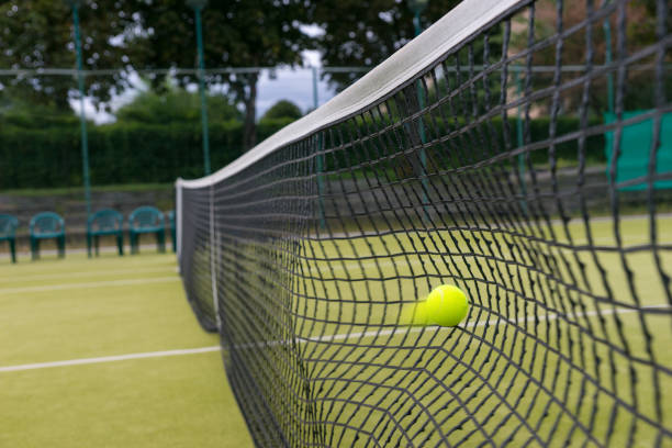 istock Tennis ball hit the net during the match 639139574