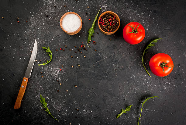 Kitchen table with a knife, spices & herbs