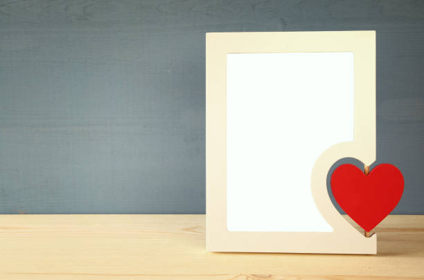 istock Blank photo frame with red heart 639140238