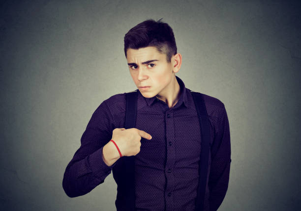 istock angry guy pointing finger at himself you mean me 639140912