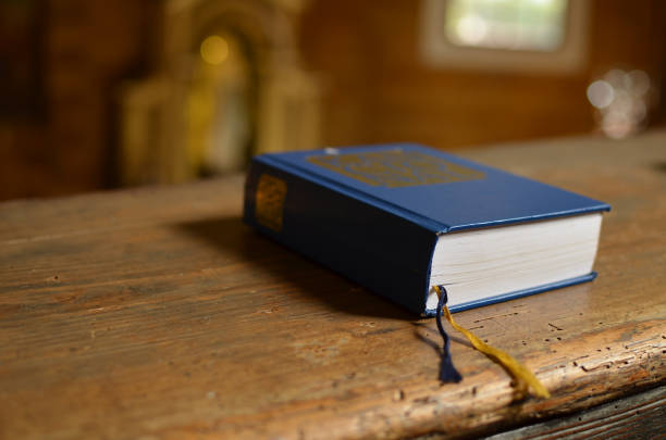 istock Holy Bible lying on a bench in church 639144728