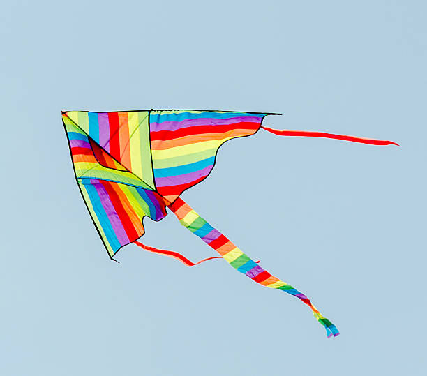 istock Vivid colored kite in the blue sky, close up 639148090