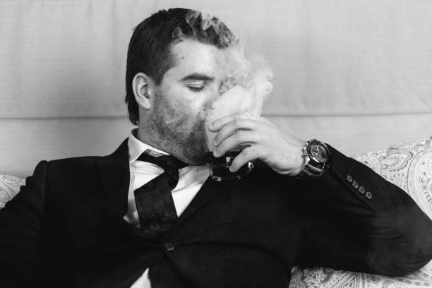 istock businessman drinking a steaming drink 639148776