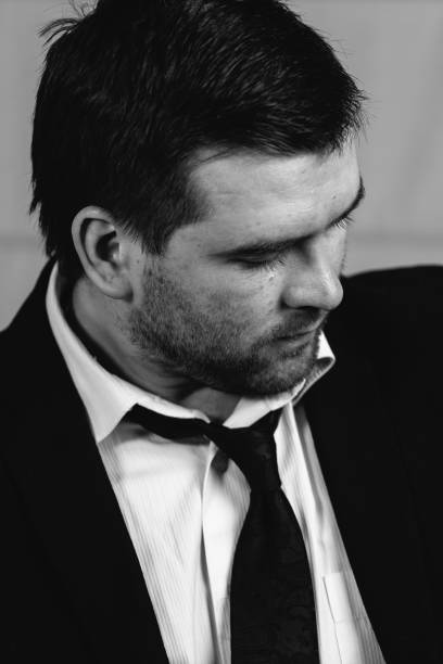 istock sad young businessman 639148830