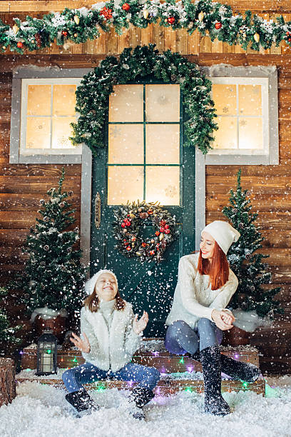 istock Mom and her daughter playing with snow 639149412