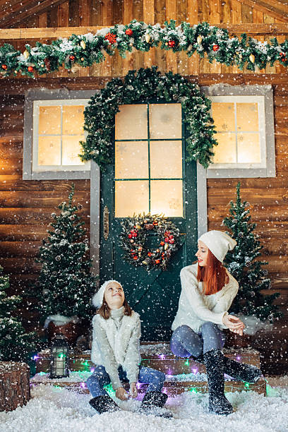 istock Mom and her daughter playing with snow 639149532