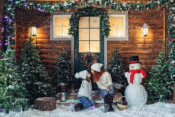istock Mom and her daughter playing with snow 639150890