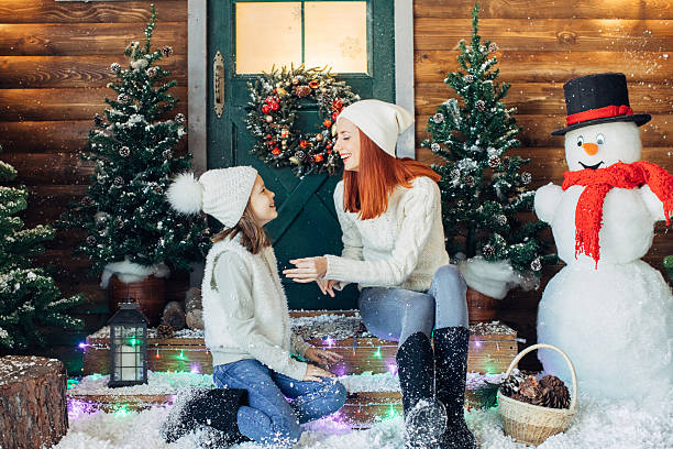 istock Mom and her daughter playing with snow 639150996