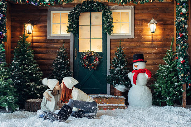 Mom and her daughter playing with snow