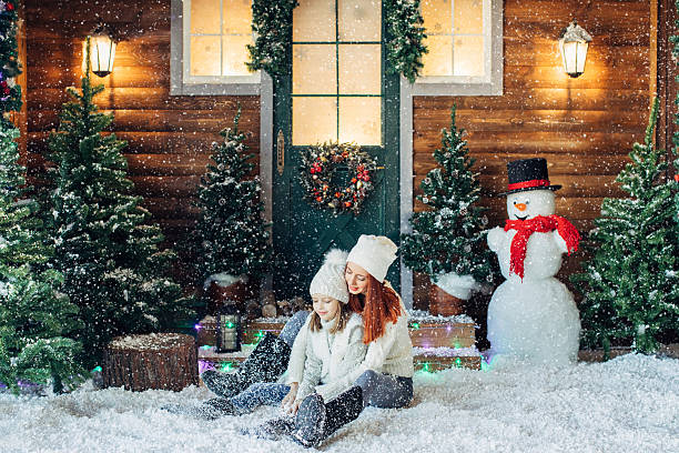istock Mom and her daughter playing with snow 639151398