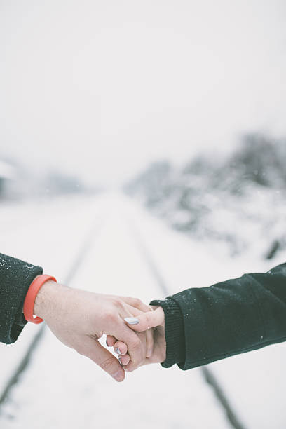 istock Couple walking on railroad 639151746