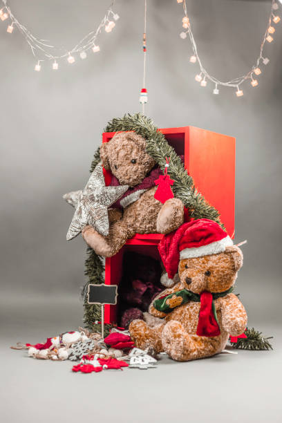 istock Christmas ornaments, lights and teddy bears in red boxes. Studio 639151822