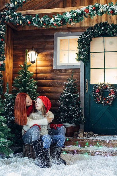 istock Mom and her daughter playing with snow 639151878
