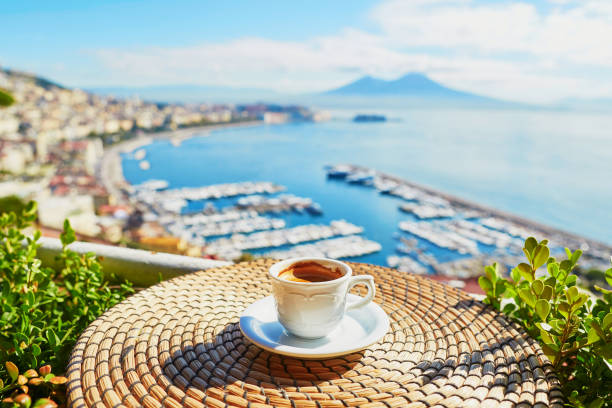 Cup of coffee with view on Vesuvius mount in Naples Cup of fresh espresso coffee in a cafe with view on Vesuvius mount in Naples, Campania, Southern Italy active volcano photos stock pictures, royalty-free photos & images