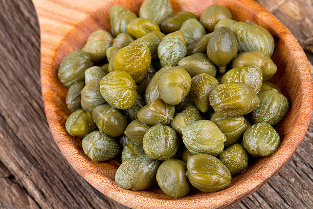 istock capers in a wooden spoon 639156034