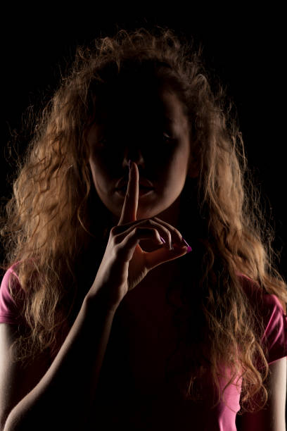 istock girl with the face in shadow 639156328