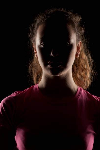 istock girl with the face in shadow 639156358