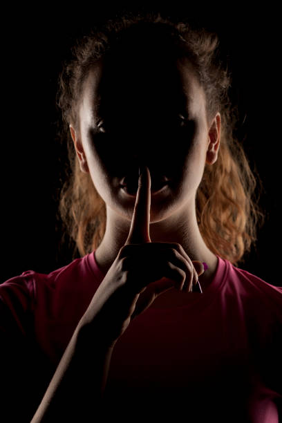 istock girl with the face in shadow 639156366