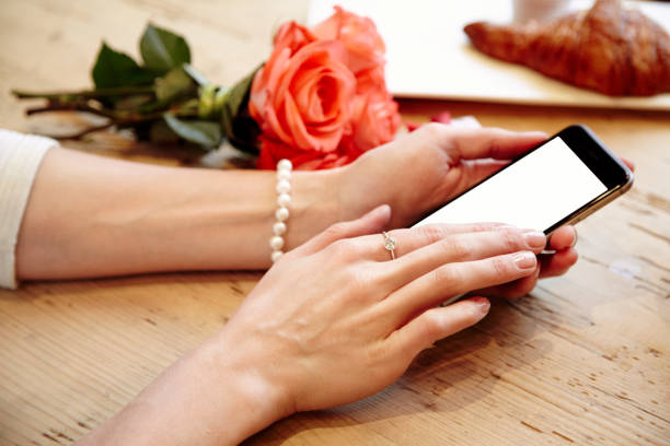 istock Close-up woman beautiful hands using phone. St. Valentine's day 639161684