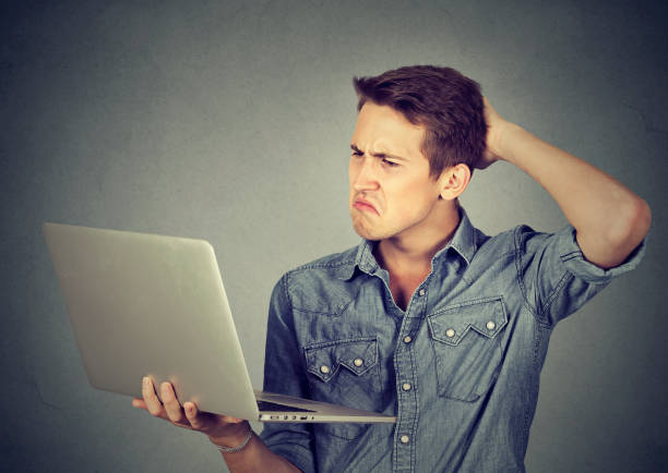 istock clueless guy having troubles with laptop. Complicated technology 639161976