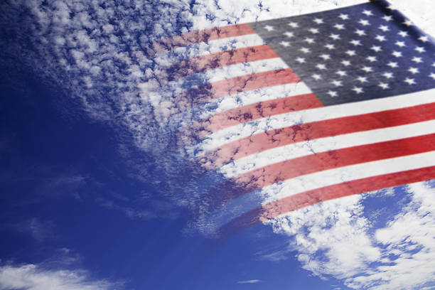 istock Background:  American flag with blue sky background. 639162424