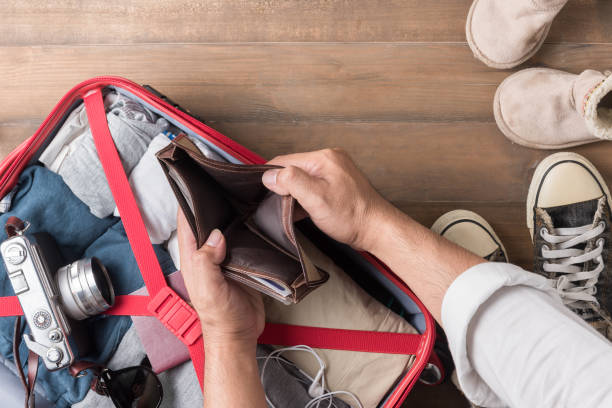 Empty wallet in the hand man on Travel accessories  background