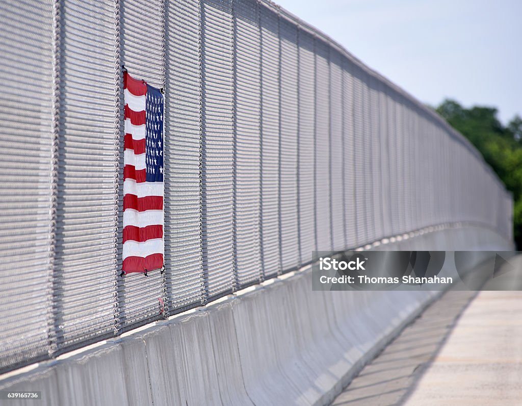 Overpass Flag Since 9/11 its has become a common sight to see the  USA flag attached to the fencing of highway bridges. American Culture Stock Photo