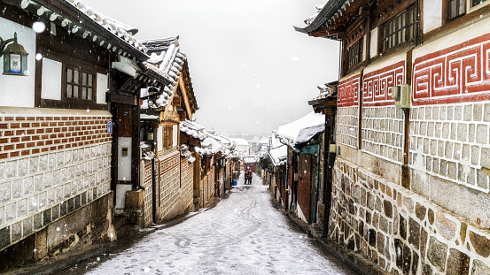 the famous alleyway in bukchon hanok village taken during a snow storm. Seoul, South Korea