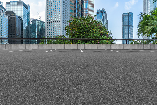 empty asphalt road with central district of Hong Kong on background,China.