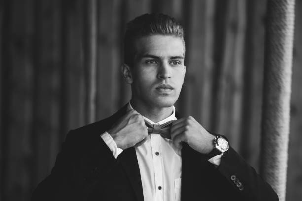 stylish handsome groom wearing bow-tie. luxury fashion wedding - wood classic fashion luxury imagens e fotografias de stock