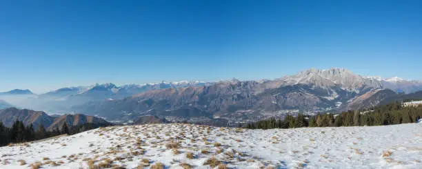 Wonderful panorama from Monte Pora to Presolana in winter season. Orobie Prealps, Bergamo, Lombardy, Italy.
