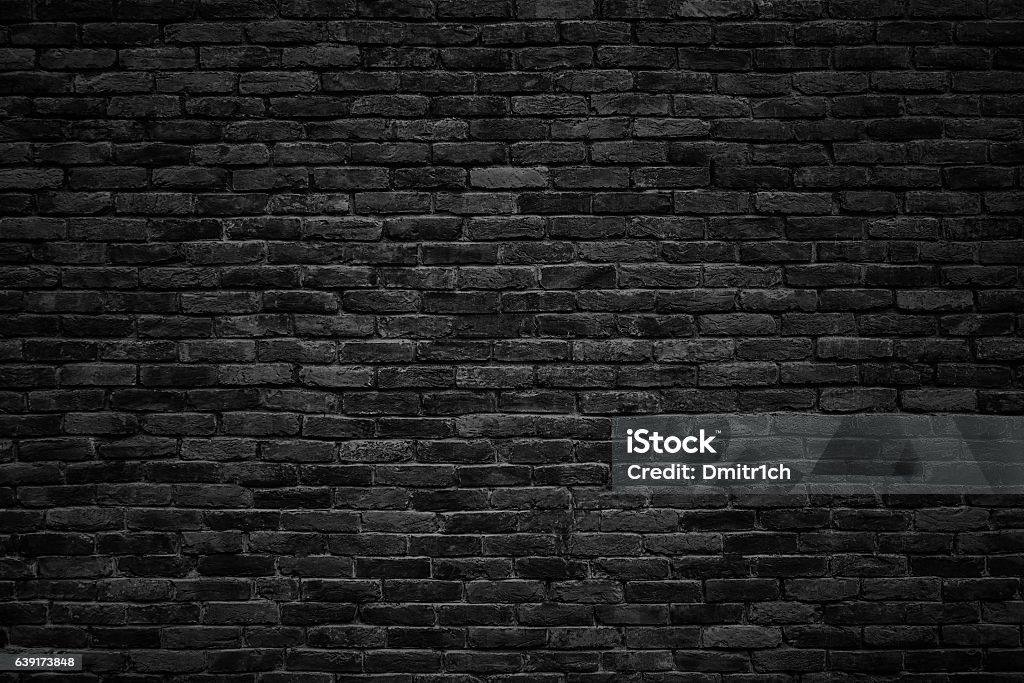 black brick wall, dark background for design gloomy background, black brick wall of dark stone texture Brick Stock Photo