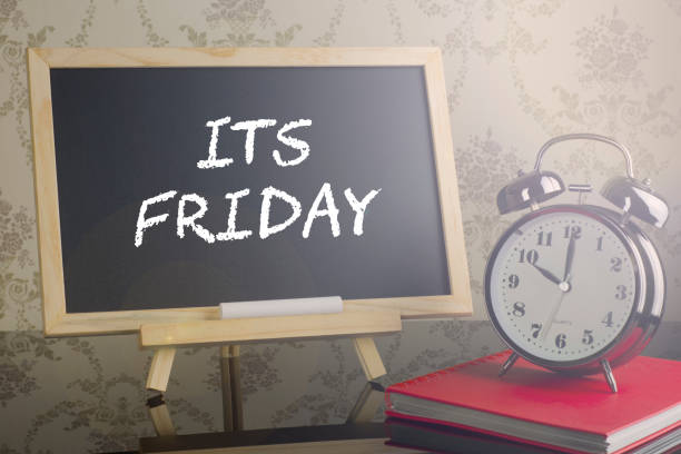 istock Its Friday on blackboard with flare and clock. 639174454