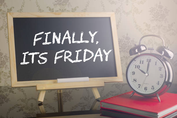 istock Final it's Friday on blackboard with flare and clock. 639174512