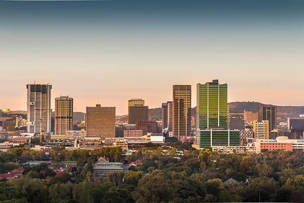 City of Pretoria skyline Pretoria (Tshwane), South Africa - April 17th, 2016. Sunrise view of city center skyline. pretoria stock pictures, royalty-free photos & images