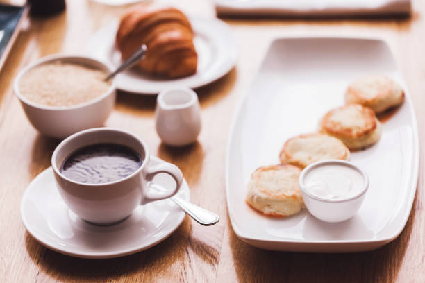 istock Breakfast: fresh coffee, croissant and cheese cakes 639177152
