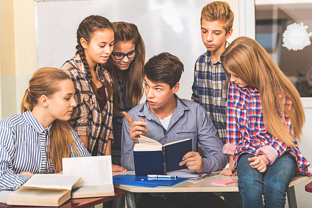 istock Concentrated teenagers in light classroom 639182660