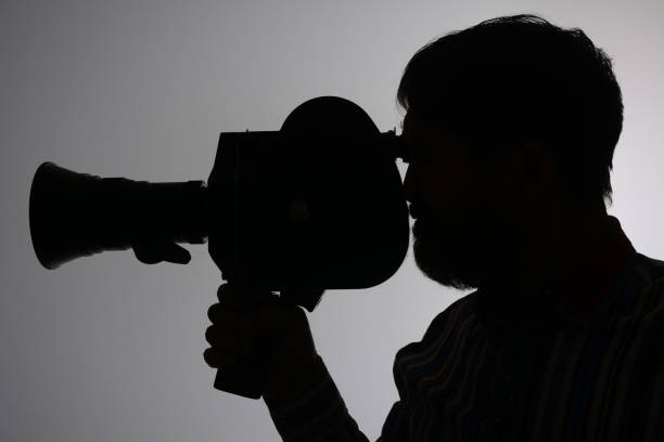 istock Silhouette bearded Man Movie Camera aside 639182872