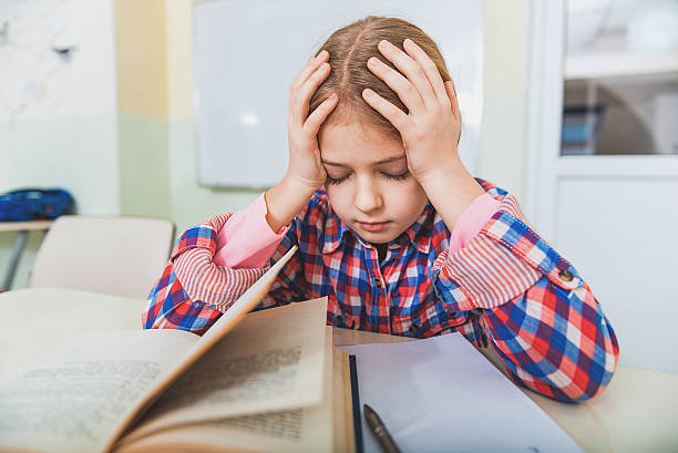 istock Exhausted girl near equipment for study 639185954